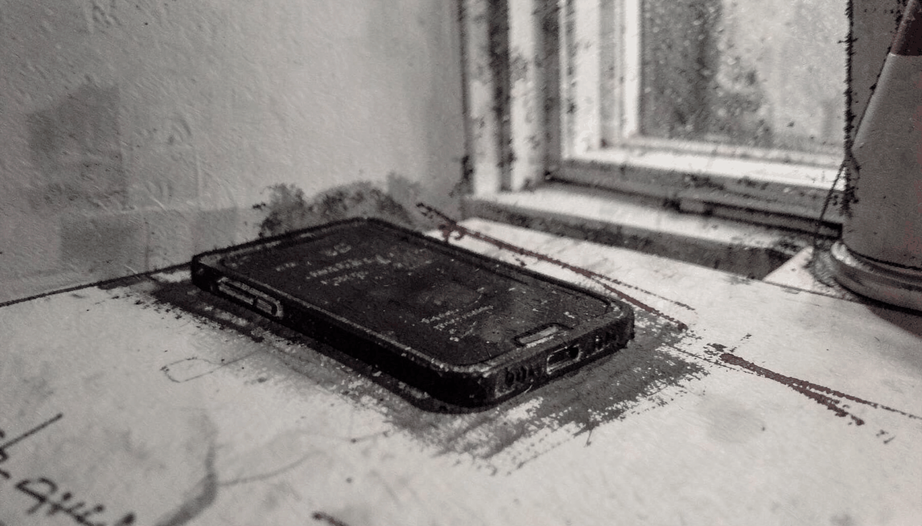 A dark charcoal-toned drawing of a smartphone silhouette resting on a desk beside a softly lit window, with muted grays